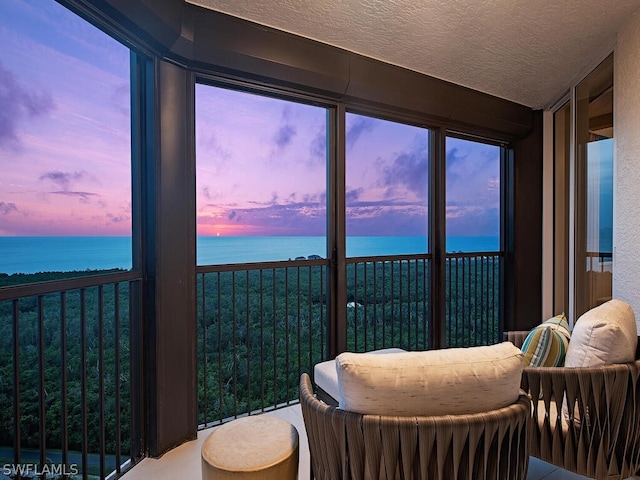 sunroom with a water view