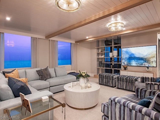 living room with beam ceiling and light colored carpet