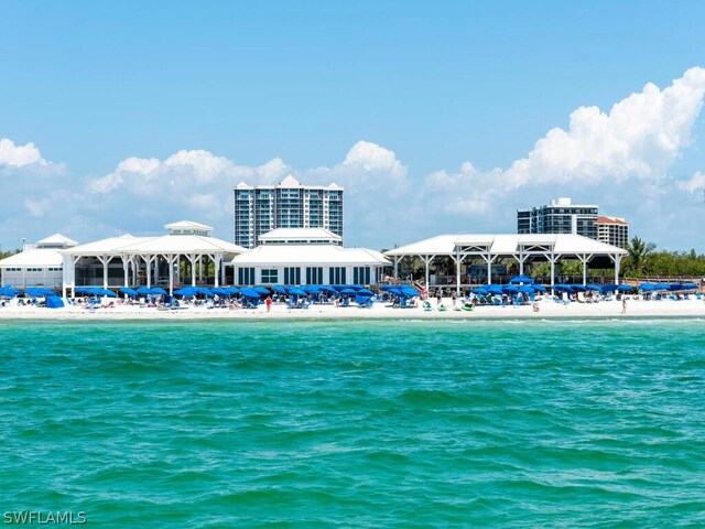 property view of water featuring a gazebo and a beach view