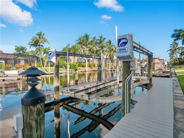 view of dock with a water view and boat lift