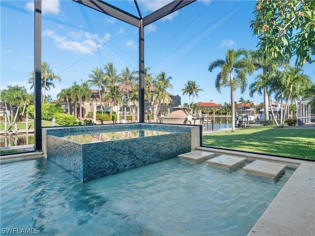 view of swimming pool featuring a water view and a lawn