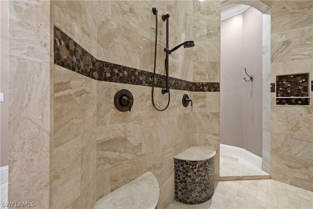 bathroom featuring tiled shower