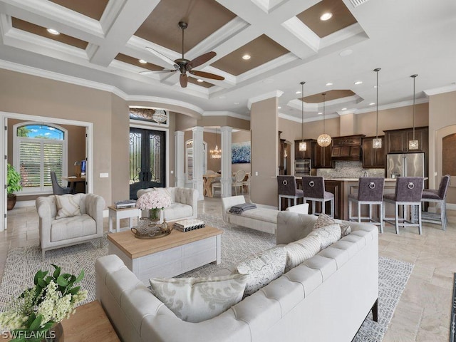 living room with ceiling fan, ornamental molding, coffered ceiling, and decorative columns