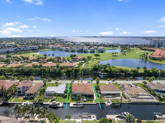 birds eye view of property featuring a water view and a residential view