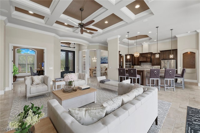 living area featuring arched walkways, a high ceiling, ornamental molding, coffered ceiling, and ornate columns