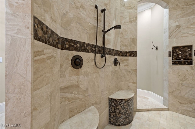 bathroom with tiled shower