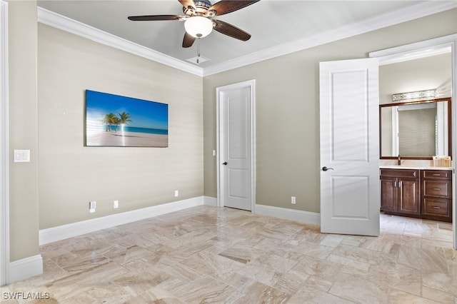 unfurnished bedroom with baseboards, ceiling fan, ornamental molding, ensuite bathroom, and a sink