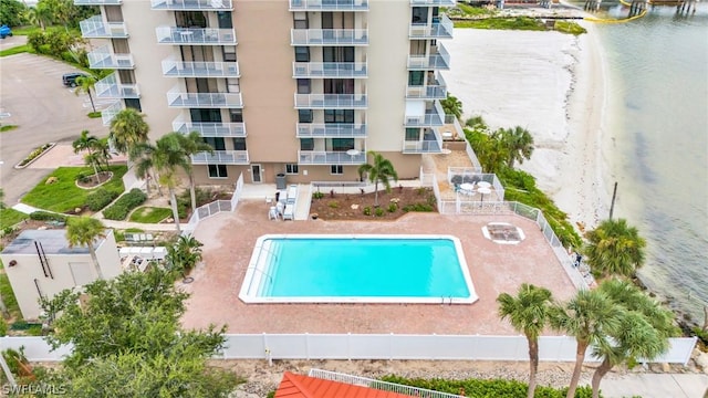 view of pool featuring a water view