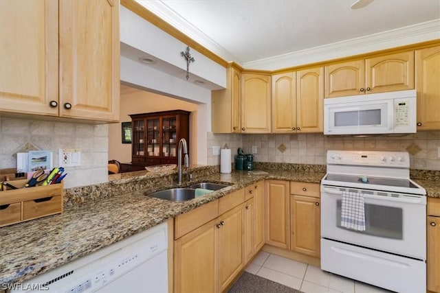 kitchen featuring light brown cabinetry, tasteful backsplash, white appliances, sink, and stone counters