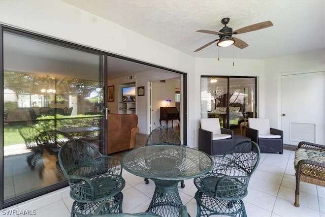 interior space featuring ceiling fan and a healthy amount of sunlight