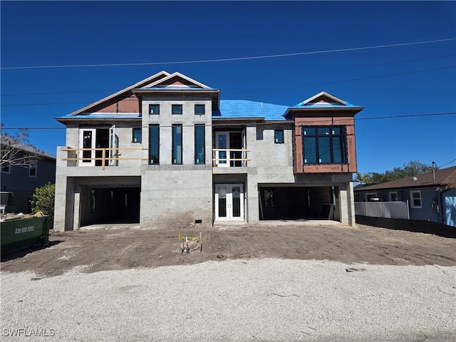 view of front facade featuring a garage and french doors