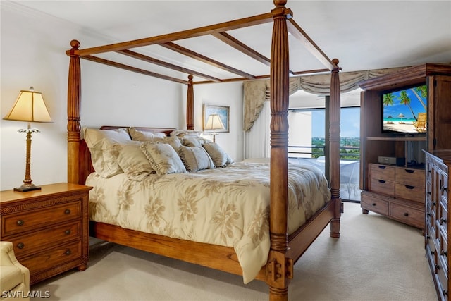 bedroom with carpet and beamed ceiling