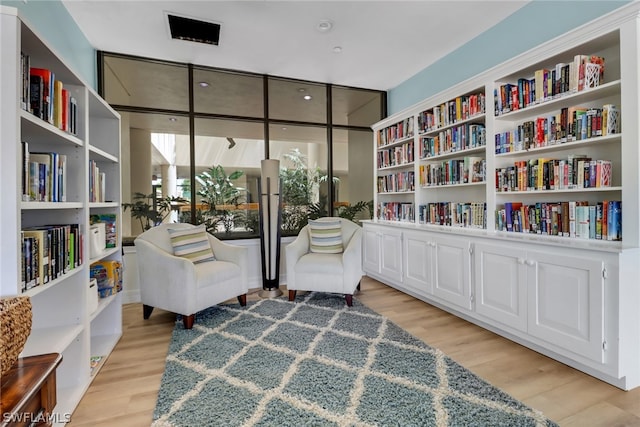 sitting room with light wood-type flooring