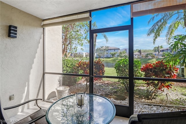 sunroom with a water view