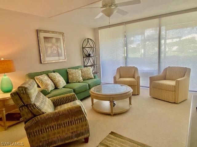 living room featuring ceiling fan