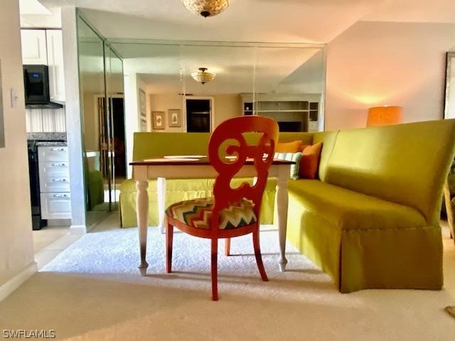 view of carpeted dining space