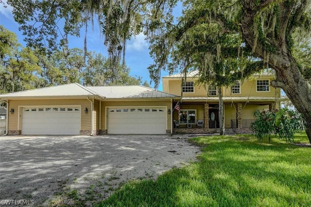 view of front facade with a garage and a front lawn