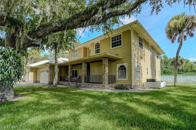 view of front facade with a garage and a front lawn