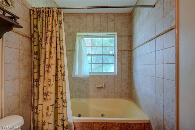 bathroom with shower / bathtub combination with curtain and toilet