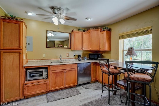 kitchen with sink, electric panel, dishwasher, and light wood-type flooring