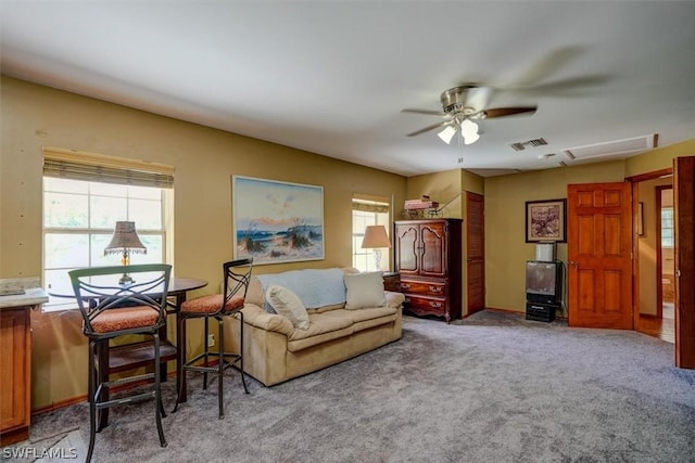 sitting room with light colored carpet and ceiling fan