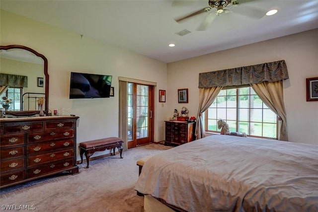 bedroom featuring ceiling fan, light carpet, and access to outside