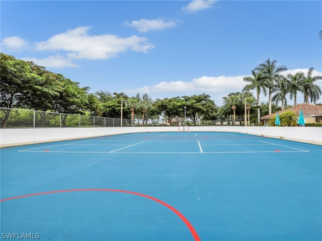 view of sport court with basketball hoop