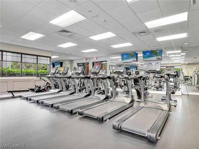 exercise room featuring a paneled ceiling