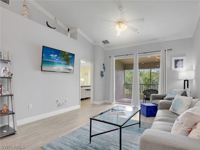 living room featuring ceiling fan, crown molding, and light hardwood / wood-style floors