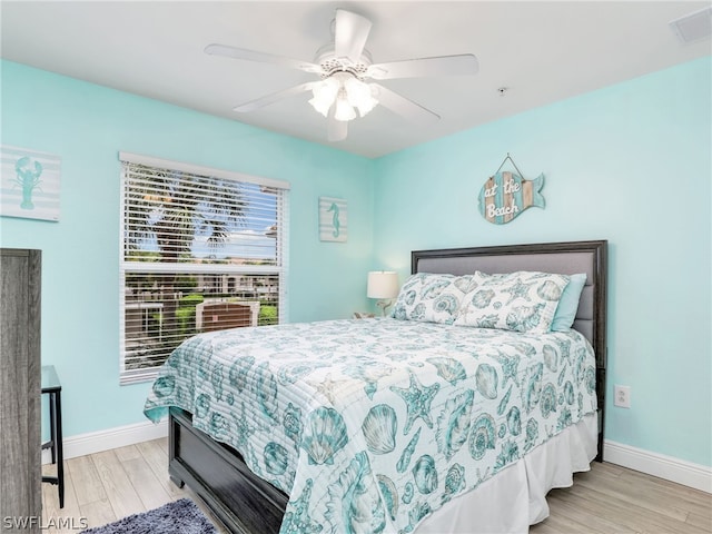 bedroom featuring ceiling fan and light hardwood / wood-style floors