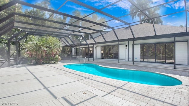 view of pool with a lanai and a patio area