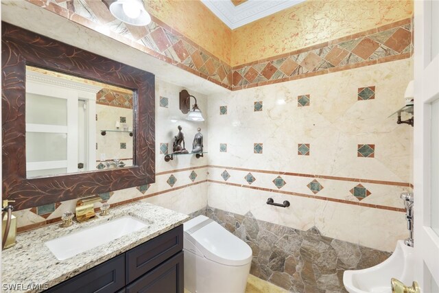 bathroom featuring toilet, tile walls, and vanity