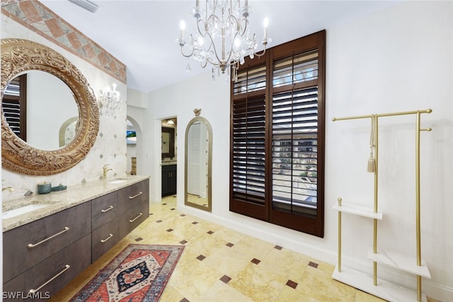 bathroom featuring vanity and an inviting chandelier