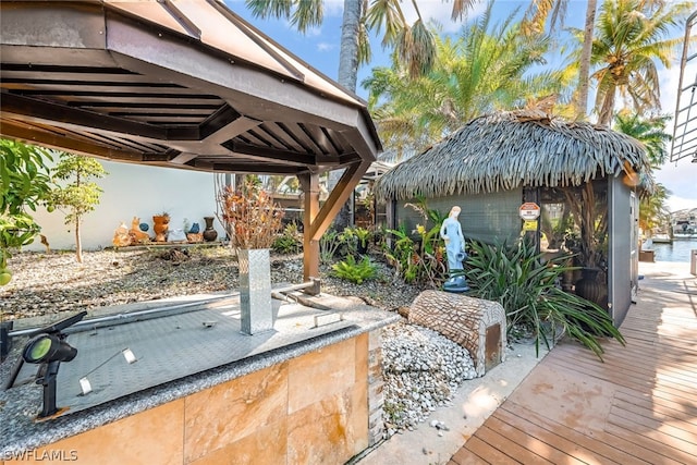 view of patio / terrace with a wooden deck and a gazebo