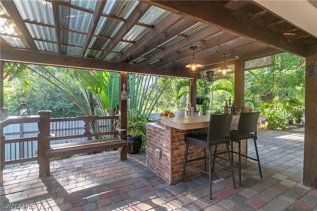 view of patio / terrace featuring an outdoor bar