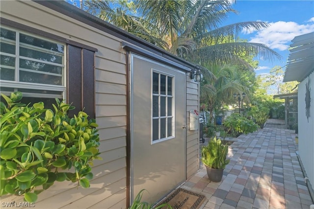 view of side of property featuring a patio area