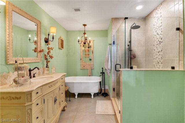 bathroom featuring vanity, tile patterned flooring, an inviting chandelier, and plus walk in shower