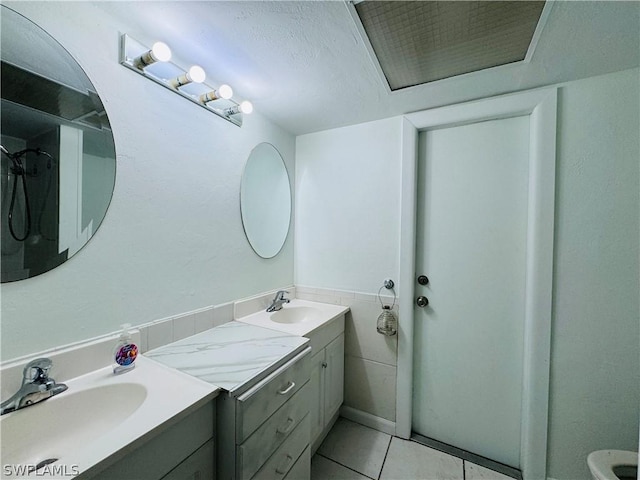 bathroom with vanity and tile patterned floors