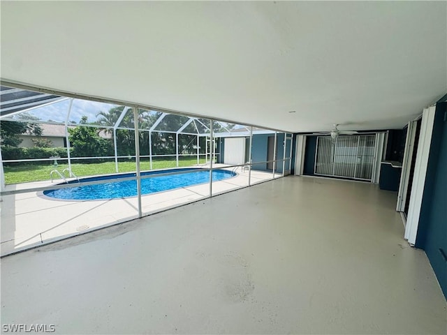 view of pool with a patio, a shed, a lanai, and a lawn