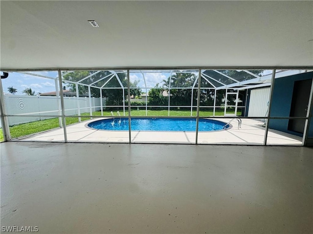 view of pool featuring a patio area, a lanai, and a yard