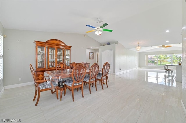 dining space featuring vaulted ceiling and ceiling fan