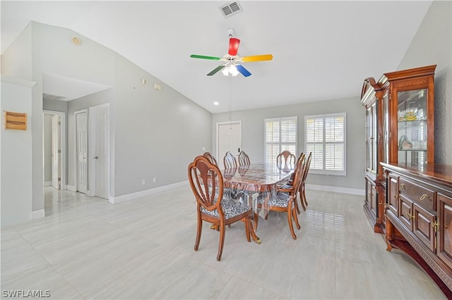 dining room with ceiling fan and vaulted ceiling