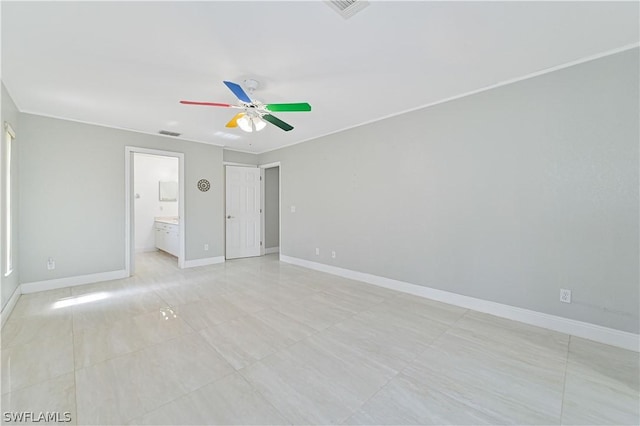 unfurnished bedroom featuring ornamental molding, ceiling fan, and ensuite bathroom