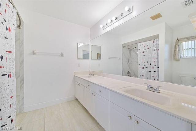 bathroom with a shower with curtain, vanity, toilet, and tile patterned flooring