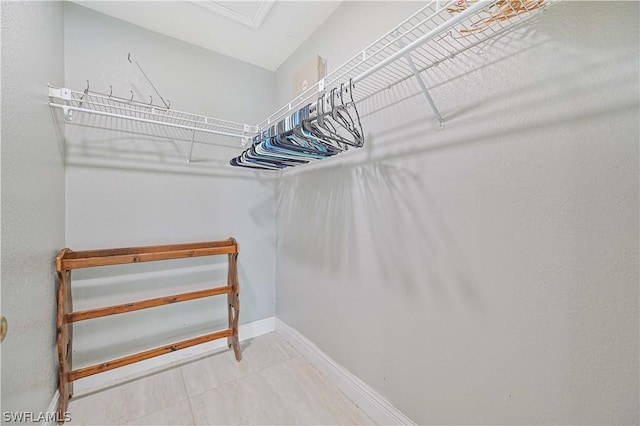 walk in closet featuring tile patterned floors