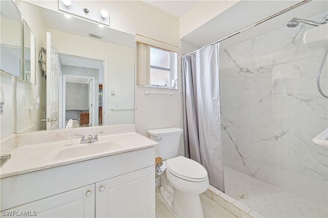 bathroom with vanity, toilet, and curtained shower