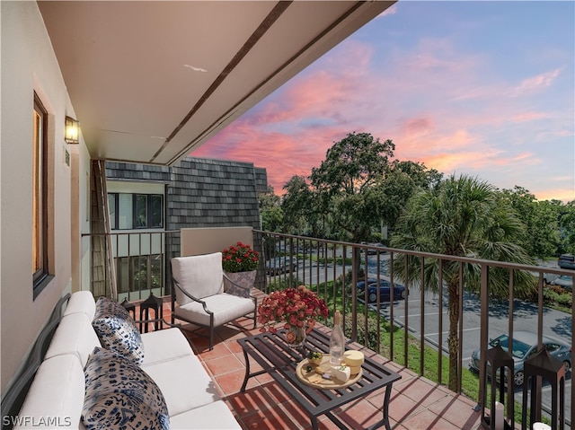 balcony at dusk with area for grilling