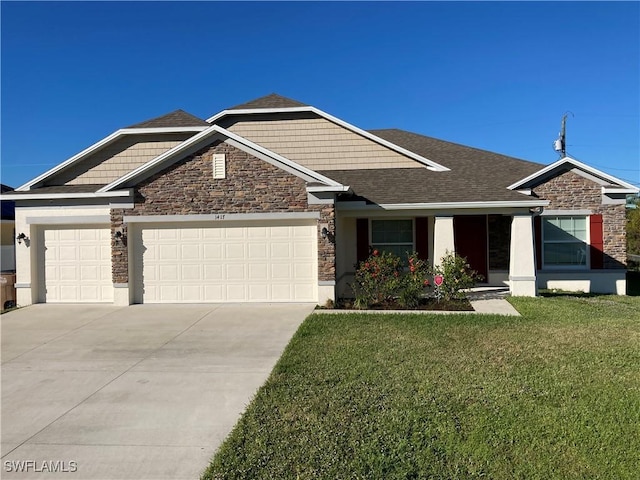 view of front of house featuring a garage and a front yard