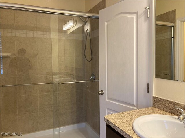 bathroom featuring vanity and walk in shower