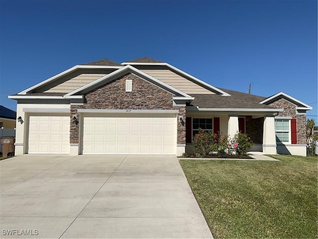 view of front of home featuring a front yard and a garage